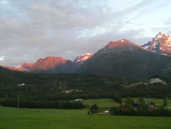 Scenic view of mountains against cloudy sky