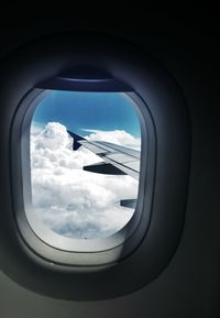 View of airplane wing seen through window