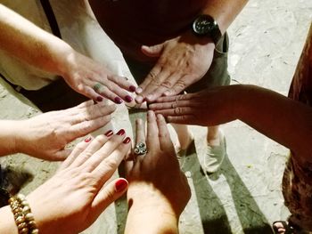 High angle view of people hands