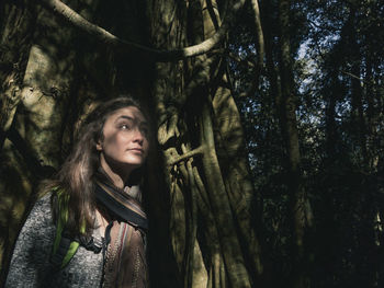 Portrait of young woman in forest