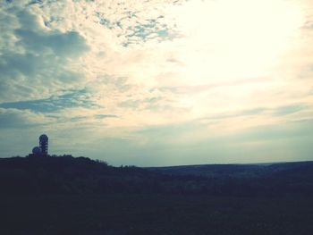 Scenic view of landscape against cloudy sky