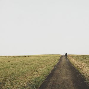 Road passing through field