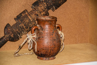 Close-up of old jar on wall