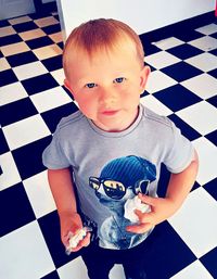 Portrait of boy playing with ball