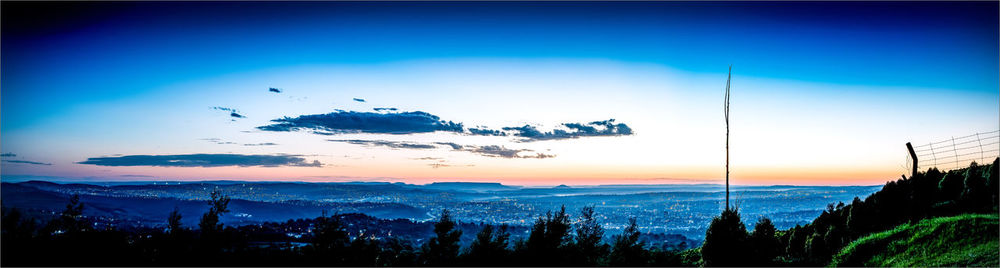 Scenic view of silhouette mountains against sky at sunset