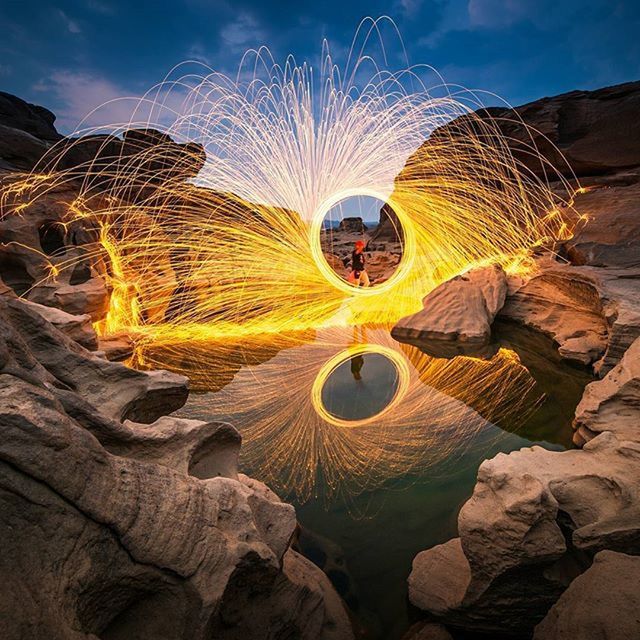 sky, nature, low angle view, circle, natural pattern, outdoors, close-up, pattern, no people, yellow, beauty in nature, tranquility, sunlight, day, rock - object, dry, illuminated, glowing, textured, creativity