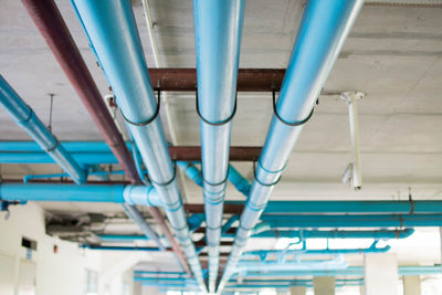 Low angle view of pipes attached to ceiling