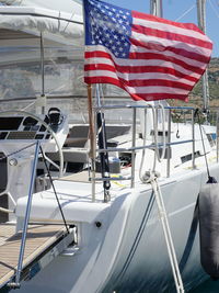 Close-up of american flag on yacht