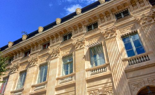 Low angle view of building against blue sky