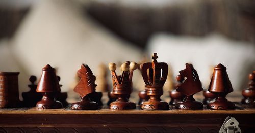 Close-up of chess pieces on table