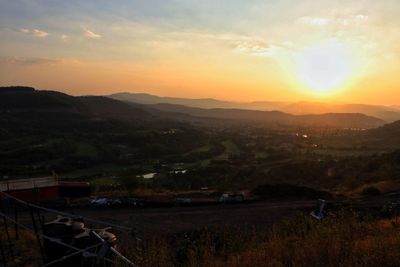 Scenic view of landscape against sky during sunset