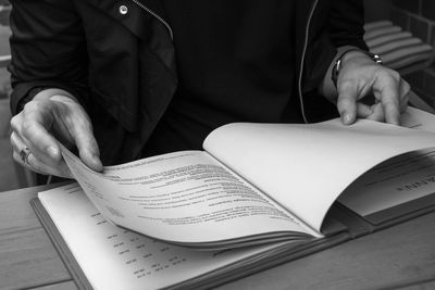 Close-up of man holding book