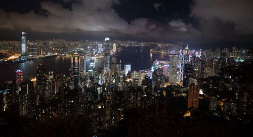 High angle view of illuminated city buildings at night