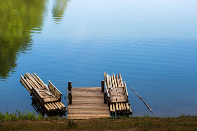 High angle view of pier over lake against blue sky