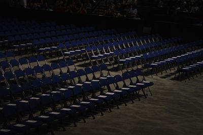 High angle view of blue chairs at school during graduation