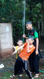 Happy women standing against the wall