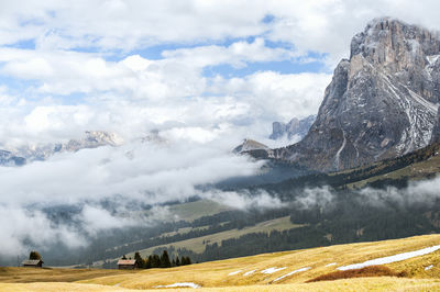Idyllic shot of rocky mountains against cloudy sky