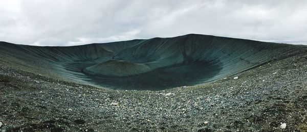 Volcanic landscape against sky