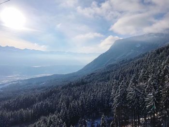 Scenic view of landscape against sky during winter