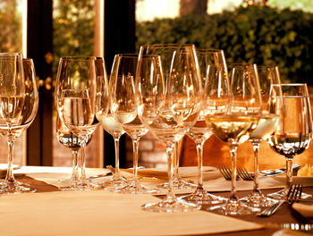 Close-up of wine glasses on table