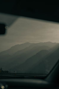 Bridge over mountains against sky