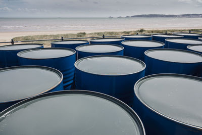 Blue barrels by the beach