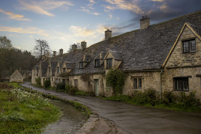 The historic stone cottages of arlington row in bibury, gloucestershire, uk