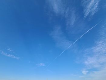 Low angle view of vapor trail in sky