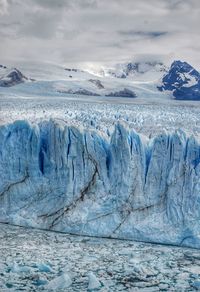 Scenic view of frozen landscape against sky