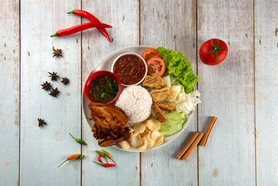 High angle view of fruits and vegetables on cutting board