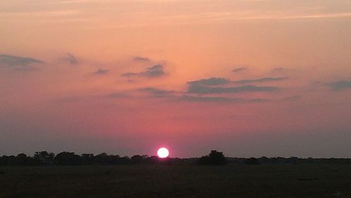 Scenic view of silhouette landscape against sky during sunset