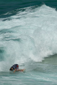 People surfing in sea