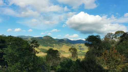 Scenic view of mountains against cloudy sky