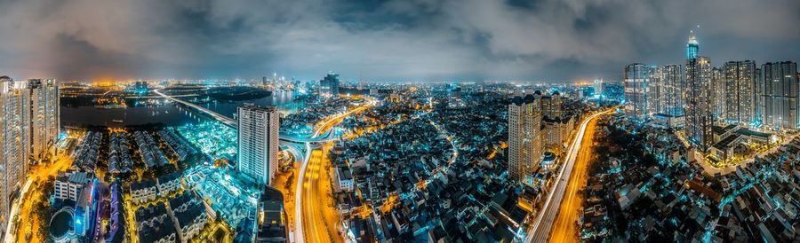 High angle view of city lit up at night