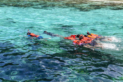 Tourist groups diving to see coral at similan islands, phang nga, thailand