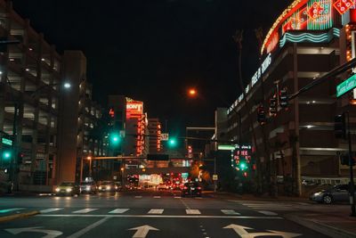 Illuminated city street at night