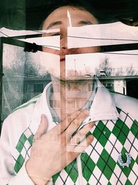 Multiple exposure of man and window