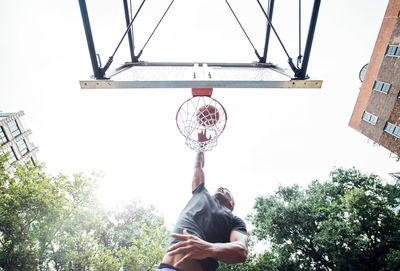 Low angle view of basketball hoop against sky