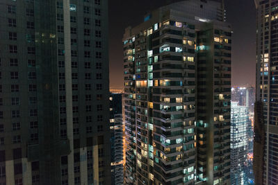 Aerial view of city lit up at night