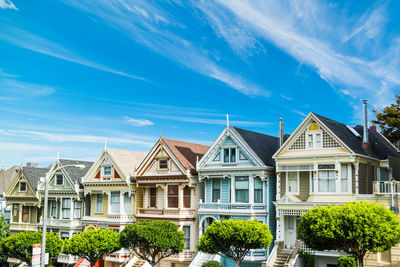 Low angle view of buildings against blue sky