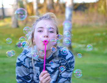 Portrait of woman in bubbles