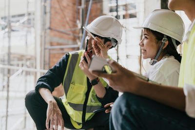 Friends using mobile phone