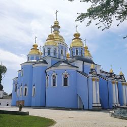 Low angle view of church against cloudy sky