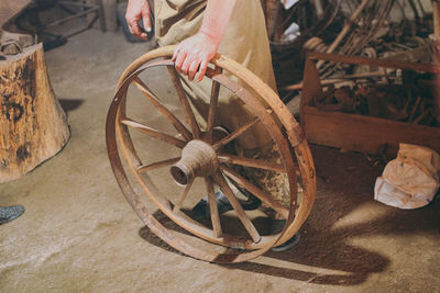 Cropped image of man working in cart