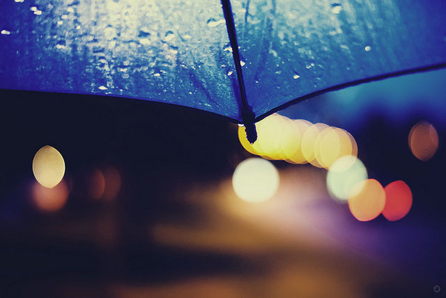 close-up, low angle view, illuminated, focus on foreground, night, circle, lighting equipment, sphere, drop, sky, fragility, lens flare, nature, mid-air, yellow, no people, beauty in nature, transparent, hanging, reflection