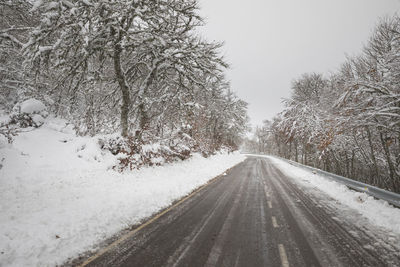 Snowy road in winter in high mountain