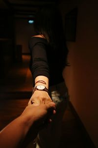 Midsection of woman standing at home