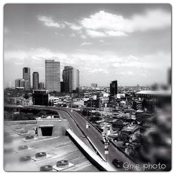 Cityscape against cloudy sky