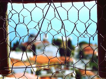 Close-up of damaged chainlink fence