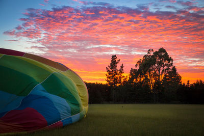 Scenic view of field against sky during sunset